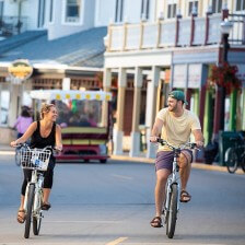 Biking along Main Street on car-free Mackinac Island, Michigan